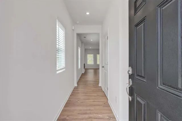 a view of a hallway with windows