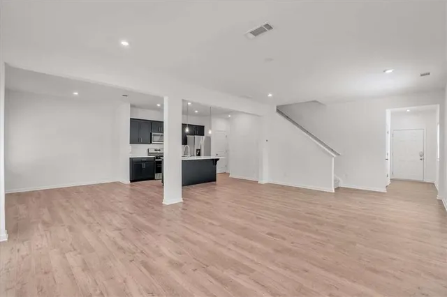 a view of a kitchen with a sink and a stove top oven