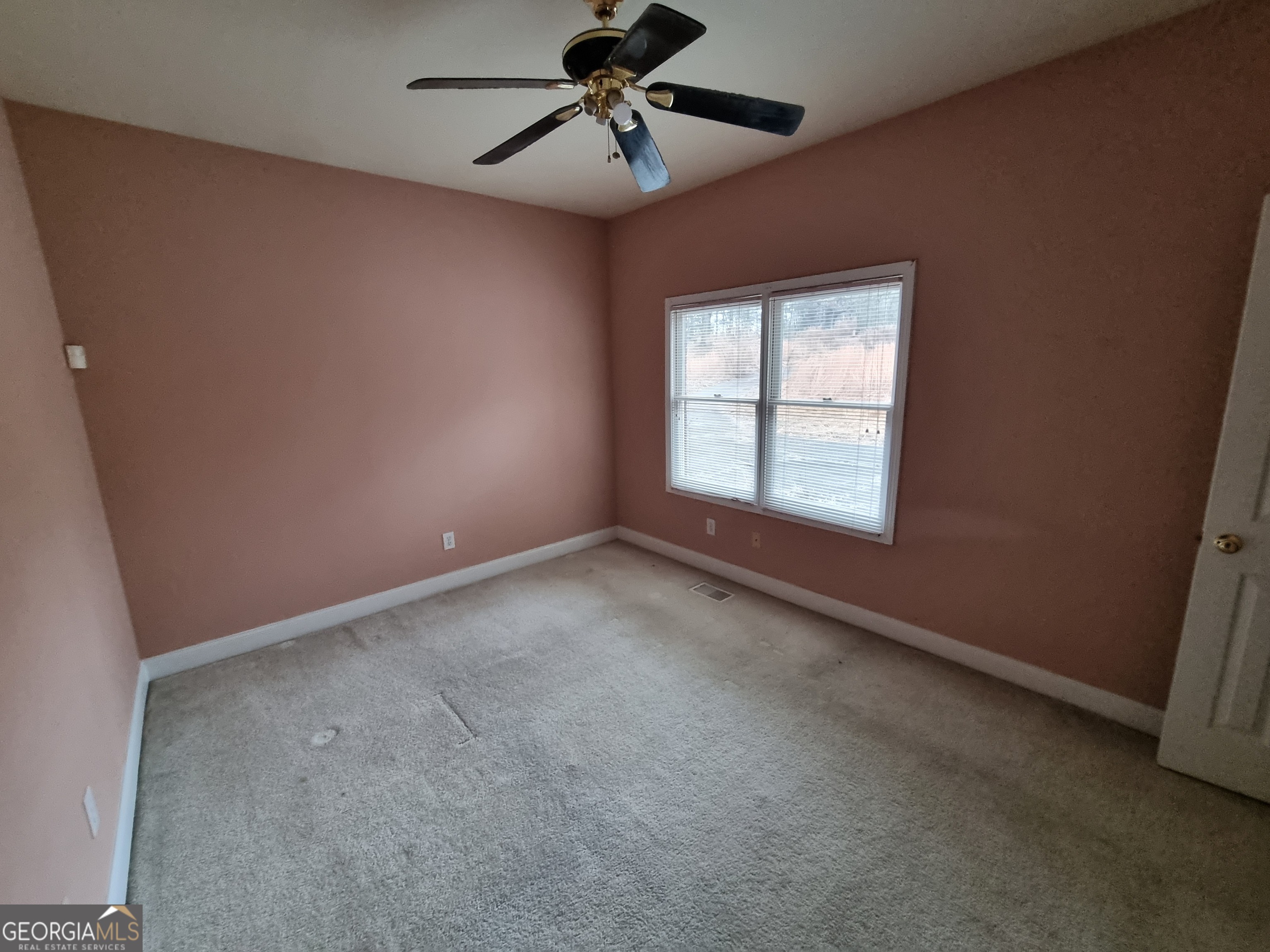 6235 Short Road Fairburn, GA 30213 - Photo 13 of 32 a view of an empty room with a window