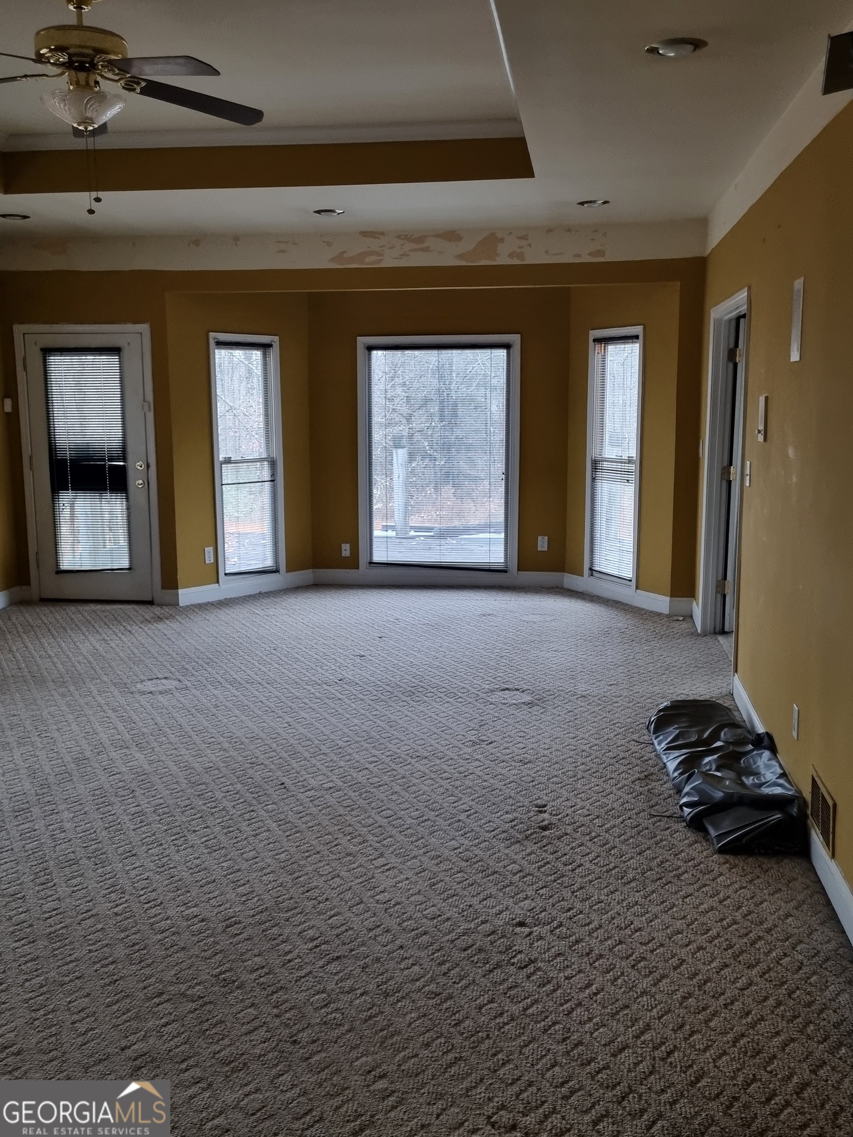 6235 Short Road Fairburn, GA 30213 - Photo 22 of 32 a view of a room with window and a ceiling fan