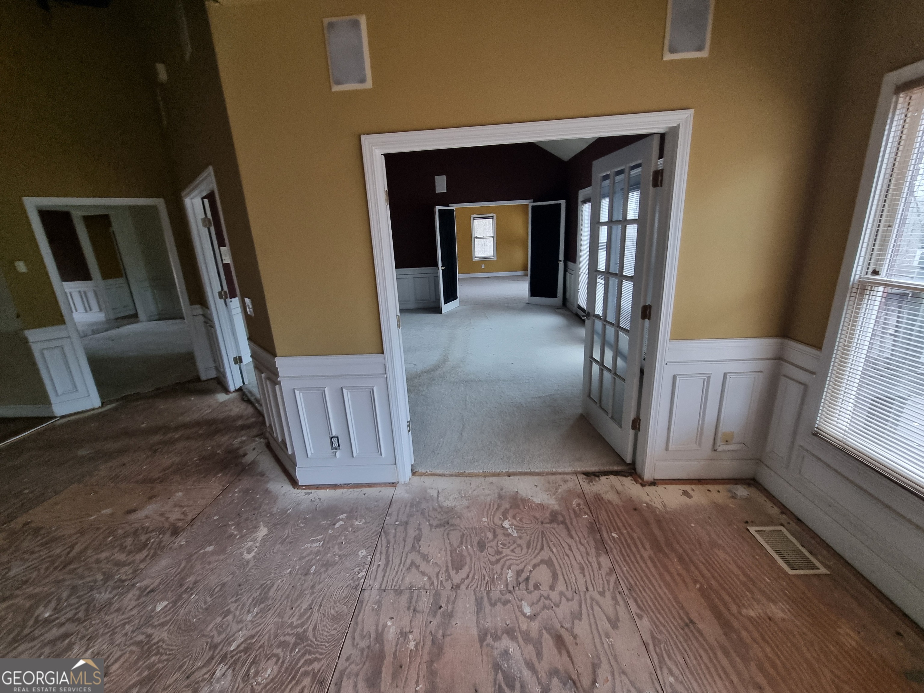 6235 Short Road Fairburn, GA 30213 - Photo 5 of 32 a view of a hallway with wooden floor and stairs