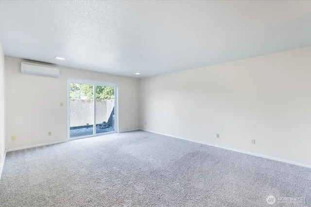 an empty room with a empty space and windows