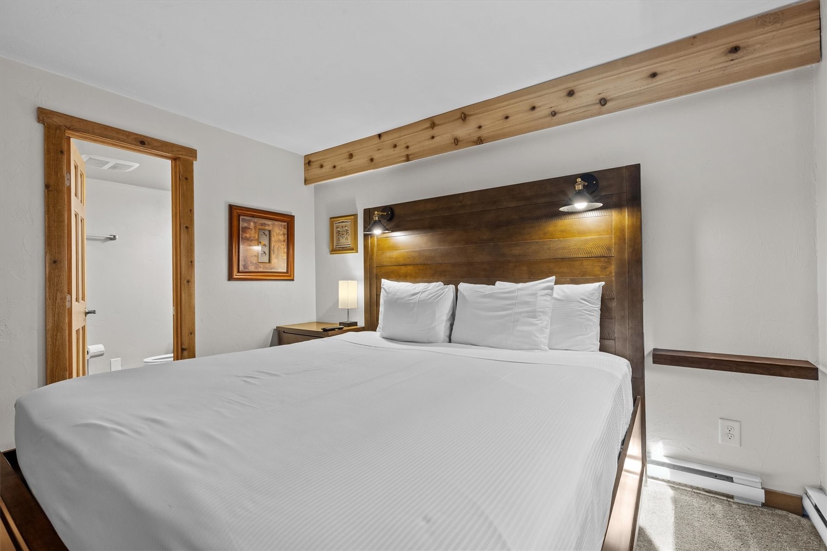 2602 Longthong Road, Unit 107 Steamboat Springs, CO 80487 - Photo 14 of 32 a large bed in a white room