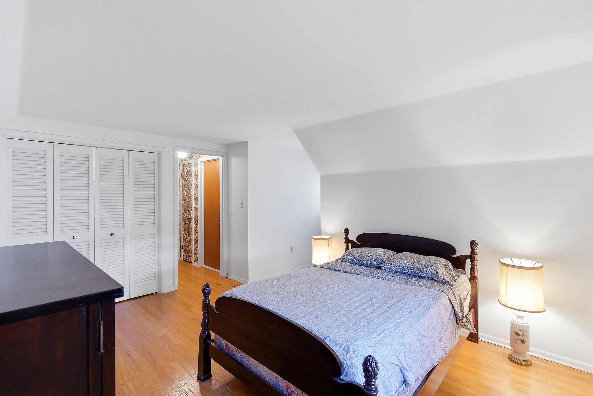 464 Newport Road Forked River, NJ 08731 - Photo 16 of 23 a bedroom with a bed and a lamp
