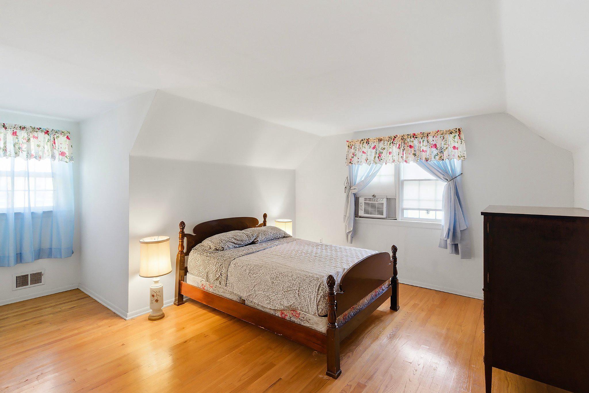 464 Newport Road Forked River, NJ 08731 - Photo 17 of 23 a bedroom with a bed and window