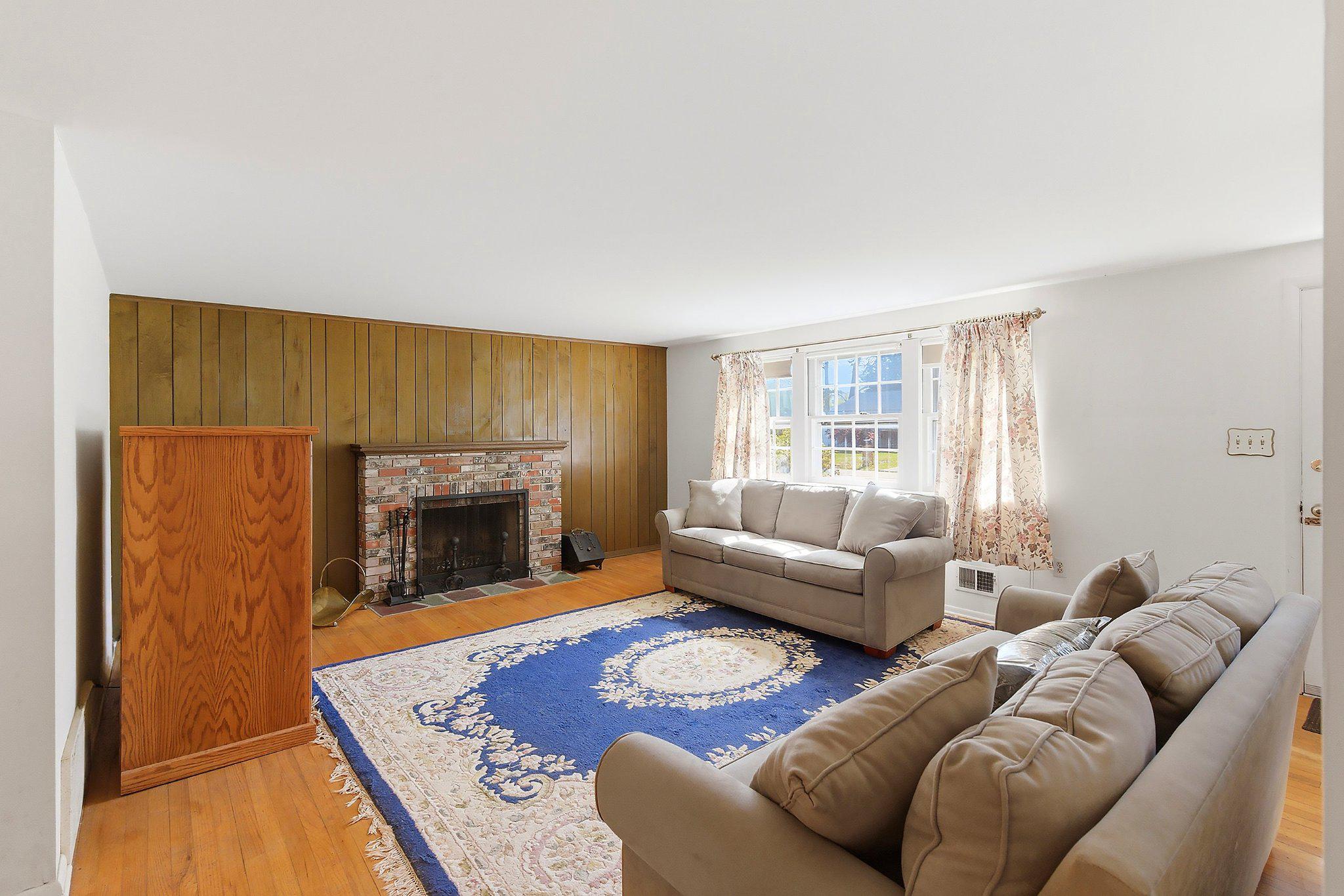 464 Newport Road Forked River, NJ 08731 - Photo 7 of 23 a living room with furniture and a fireplace