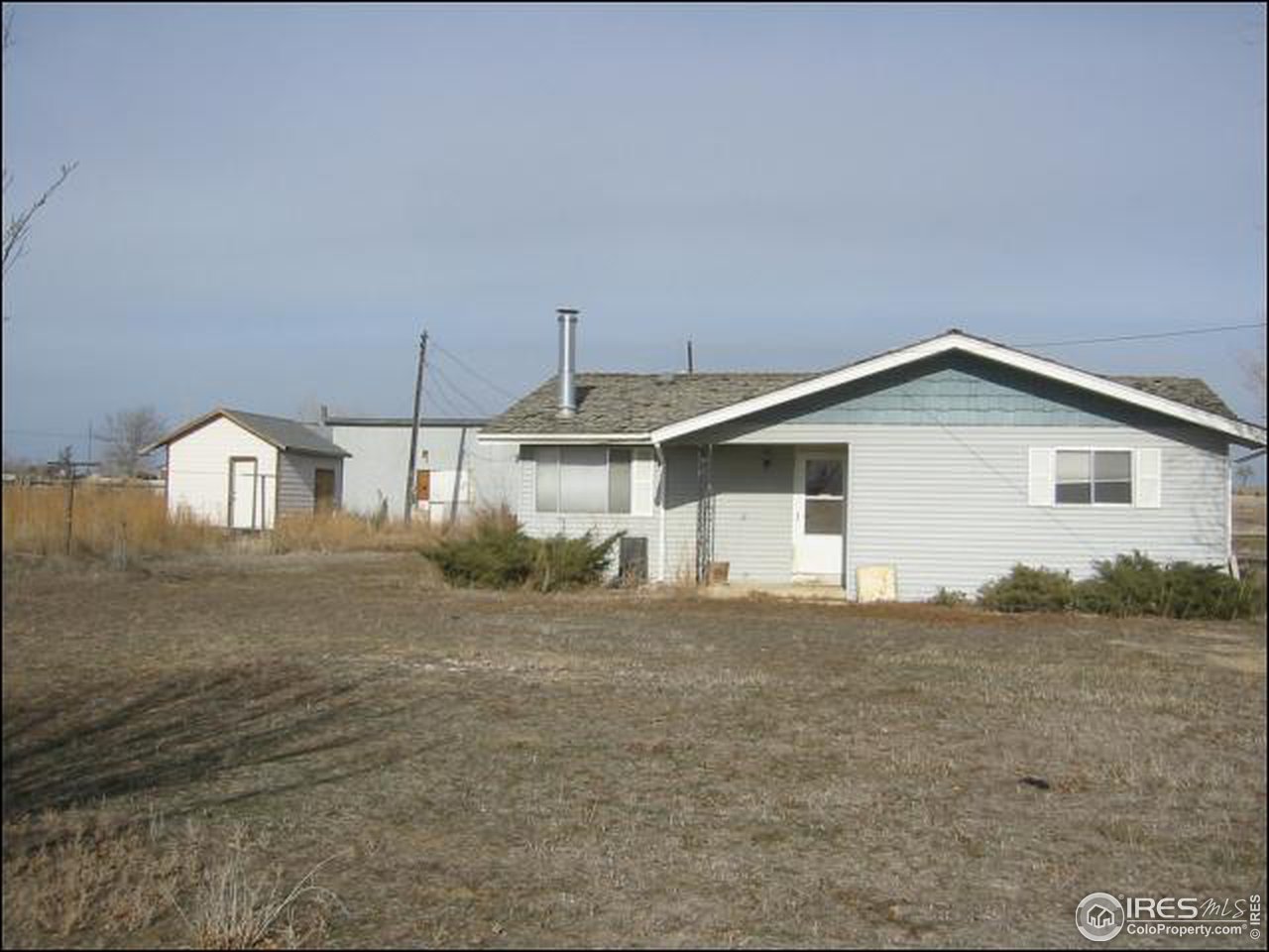 13013 East County Line Road Longmont, CO 80504 - Photo 1 of 3 a view of a house with a backyard
