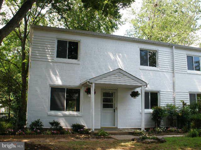 39 Ridge Road, Unit C Greenbelt, MD 20770 - Photo 2 of 22 a front view of a house with garden