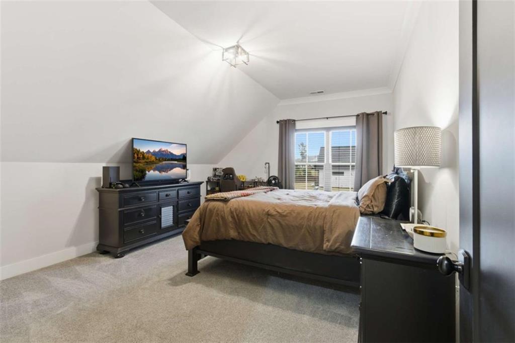 189 Waterview Circle Newnan, GA 30263 - Photo 42 of 83 a bedroom with a bed and dresser