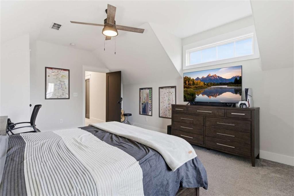 189 Waterview Circle Newnan, GA 30263 - Photo 44 of 83 a bedroom with a bed and ceiling fan