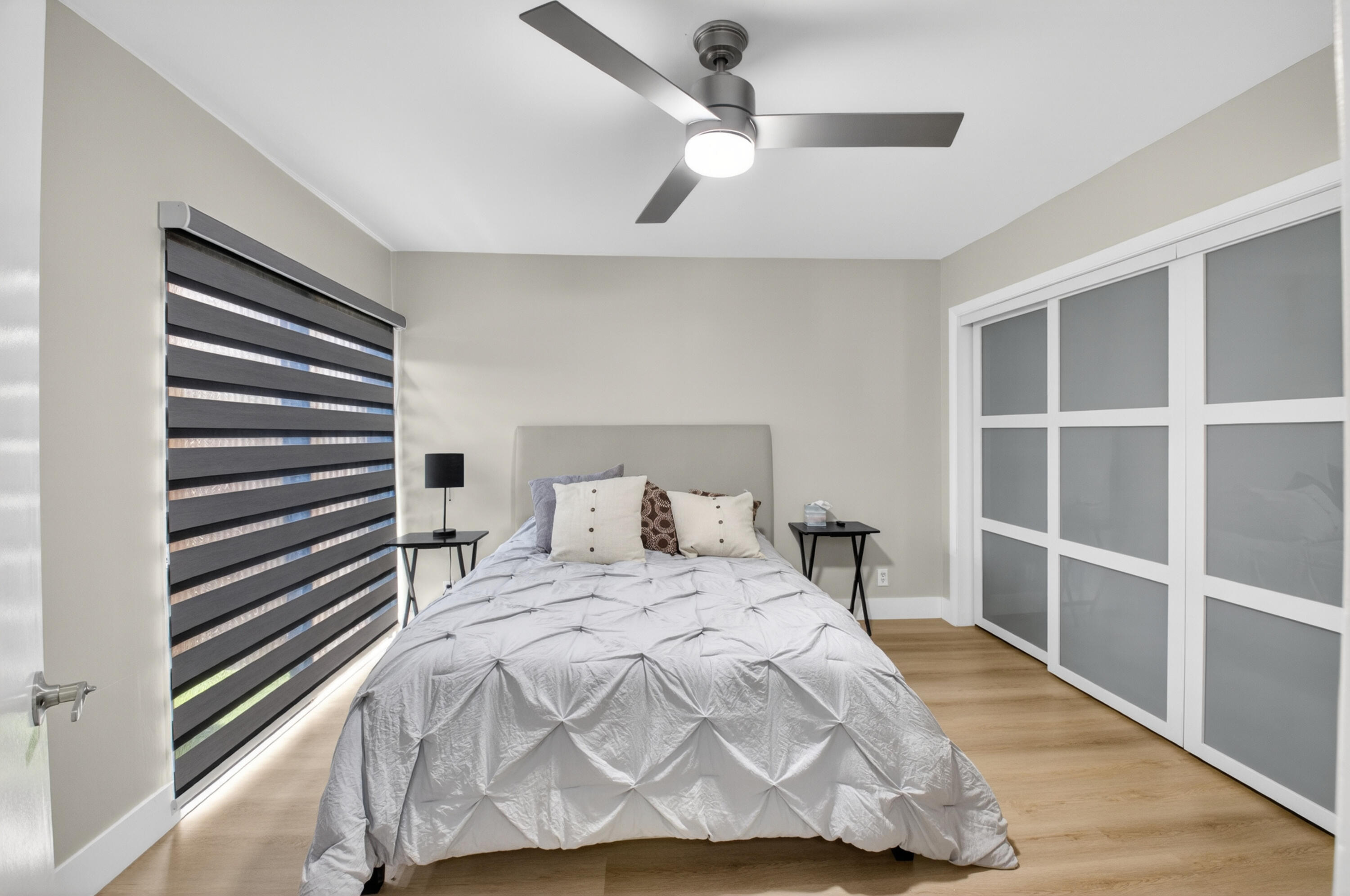 7374 Woodmont Court Boca Raton, FL 33434 - Photo 31 of 95 a bedroom with a bed and a window