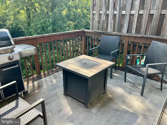 a view of a dinning table and chairs in roof deck