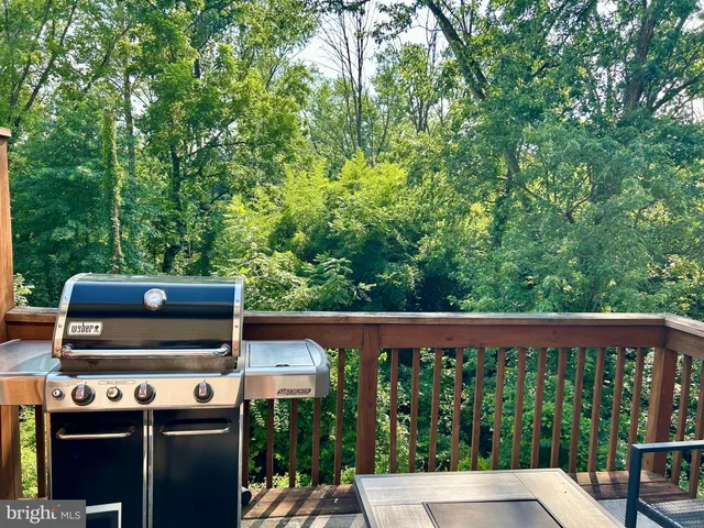 a view of a balcony with wooden floor