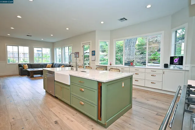a kitchen with a sink stove and cabinets