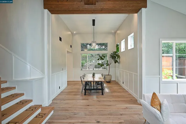 a view of a dining room with furniture window and wooden floor