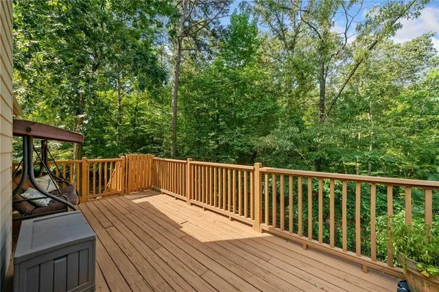 a view of house with backyard and sitting area