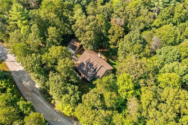 a view of a green field with an outdoor space
