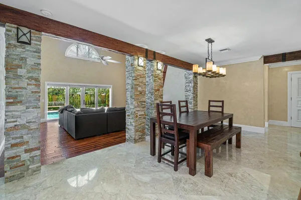 a view of a dining room with furniture window and outside view