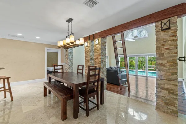 a dining room with furniture and window