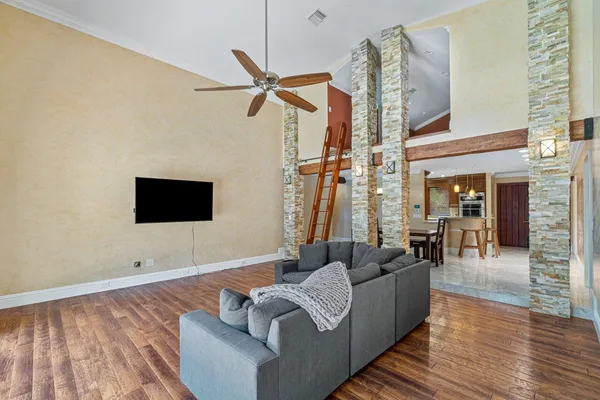 a living room with furniture and a flat screen tv