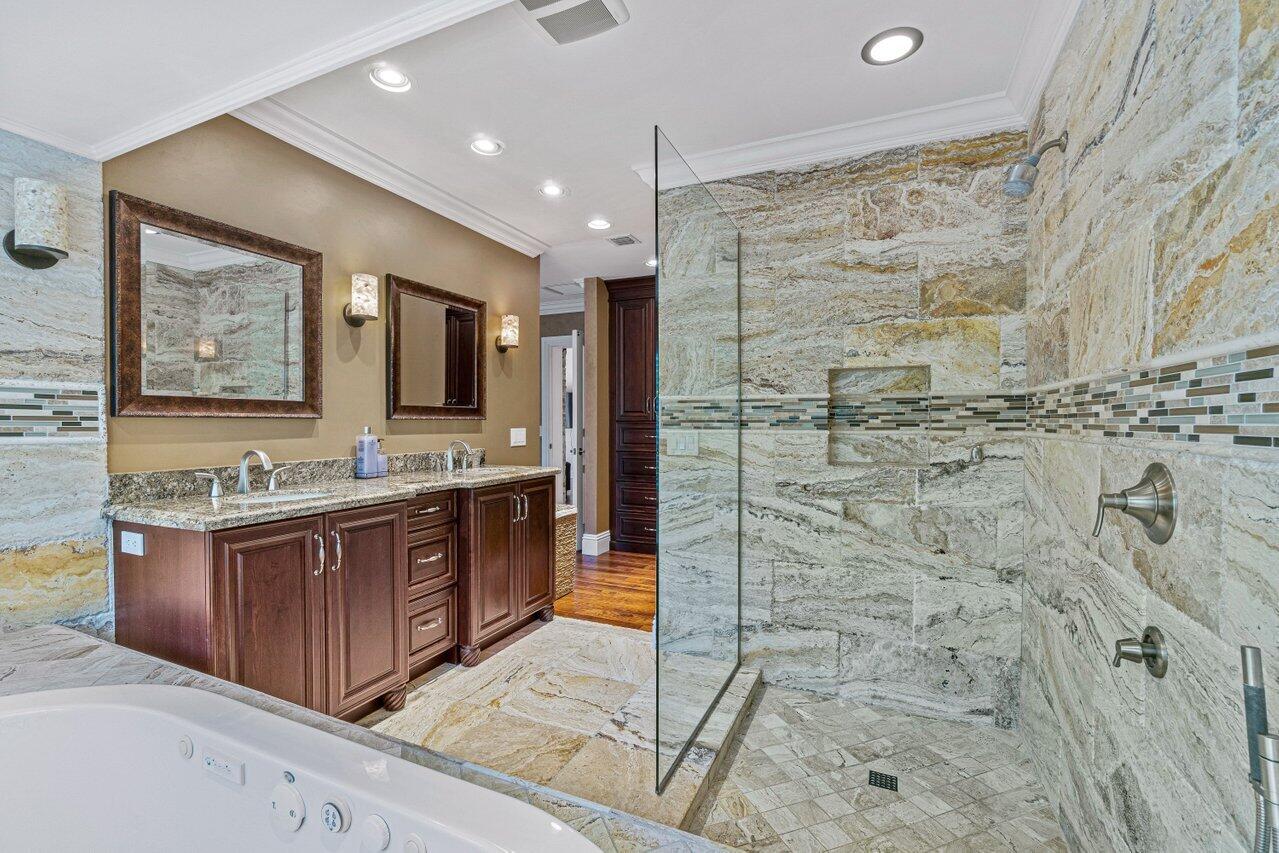 870 Northwest 7th Street Boca Raton, FL 33486 - Photo 24 of 37 a bathroom with a granite countertop sink mirror bathtub shower and double