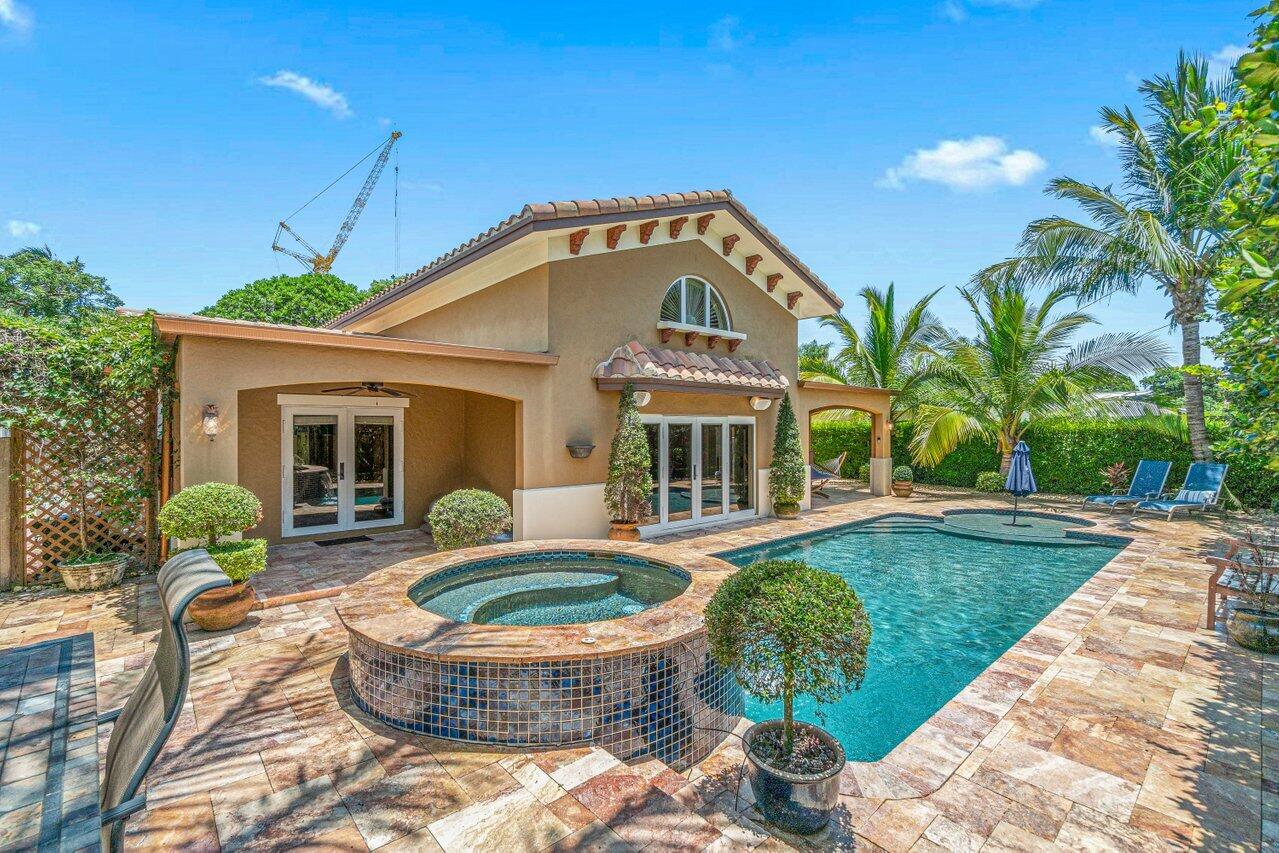 870 Northwest 7th Street Boca Raton, FL 33486 - Photo 33 of 37 a front view of a house with swimming pool outdoor seating