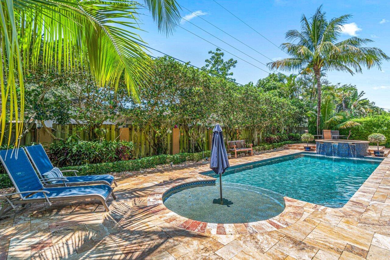 870 Northwest 7th Street Boca Raton, FL 33486 - Photo 36 of 37 a swimming pool with lots of tress