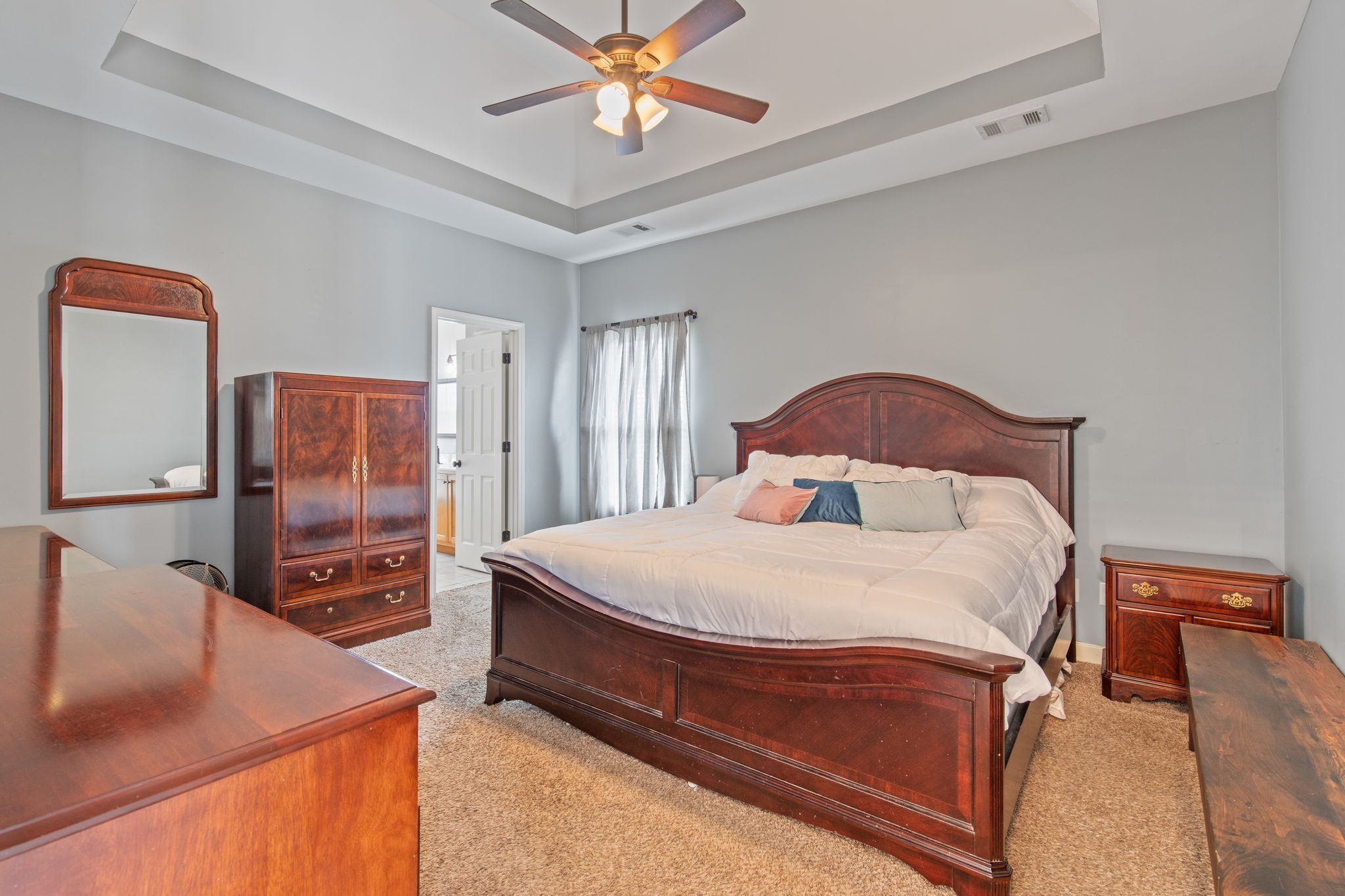 1008 Rhett Place Lebanon, TN 37087 - Photo 14 of 35 a bedroom with a bed and a flat screen tv