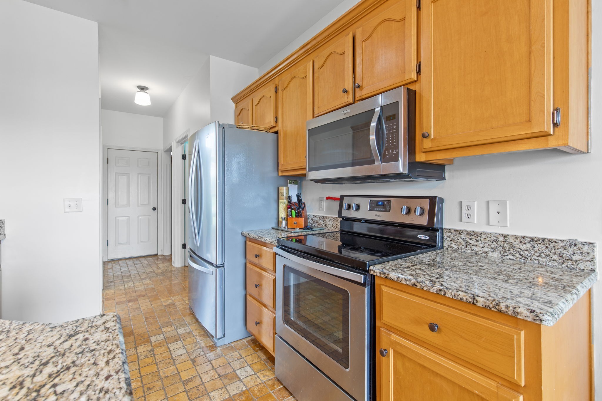 1008 Rhett Place Lebanon, TN 37087 - Photo 10 of 35 a kitchen with stainless steel appliances granite countertop a stove microwave and refrigerator