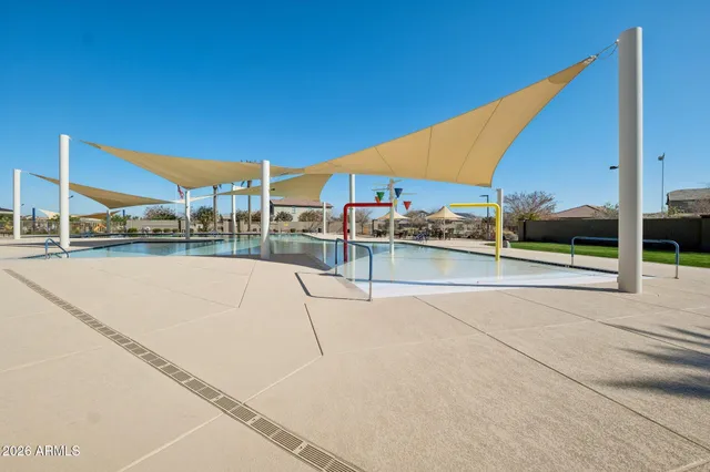 a view of a backyard with sitting area