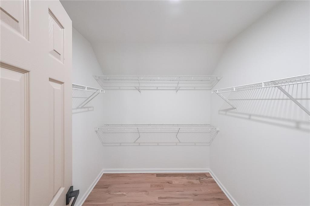 2130 Federal Road Roswell, GA 30075 - Photo 23 of 34 a view of walk in closet with empty racks