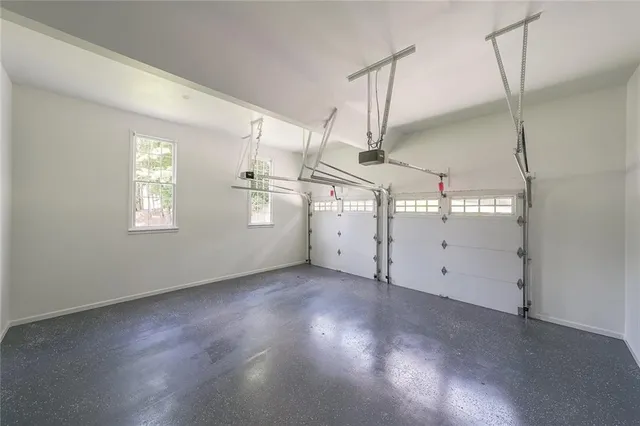 a view of a room with window and wooden floor