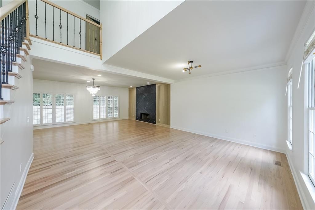 2130 Federal Road Roswell, GA 30075 - Photo 6 of 34 a view of an empty room with wooden floor and a window