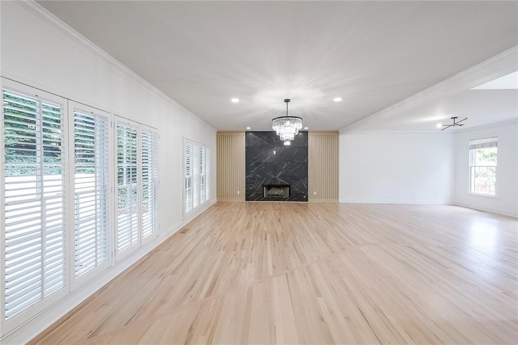 2130 Federal Road Roswell, GA 30075 - Photo 10 of 34 an empty room with wooden floor and windows