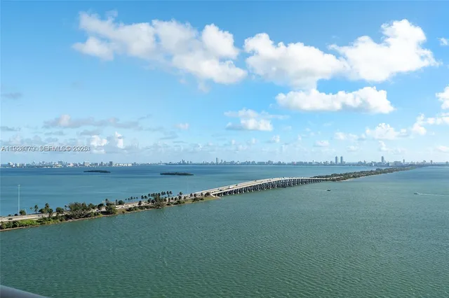 a kitchen with a stove sink and cabinets