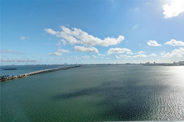 a dining room with furniture and a window