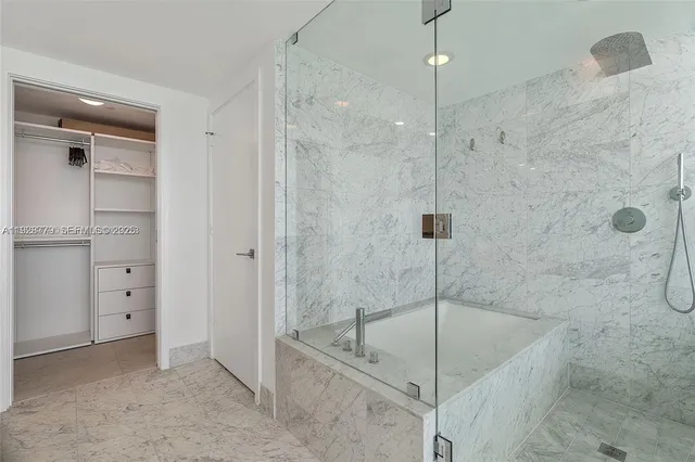 a kitchen with a sink cabinets and stainless steel appliances