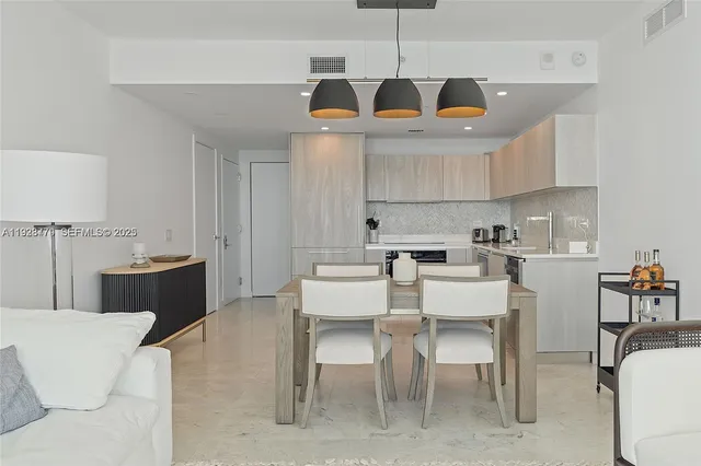 a living room with furniture and a lamp