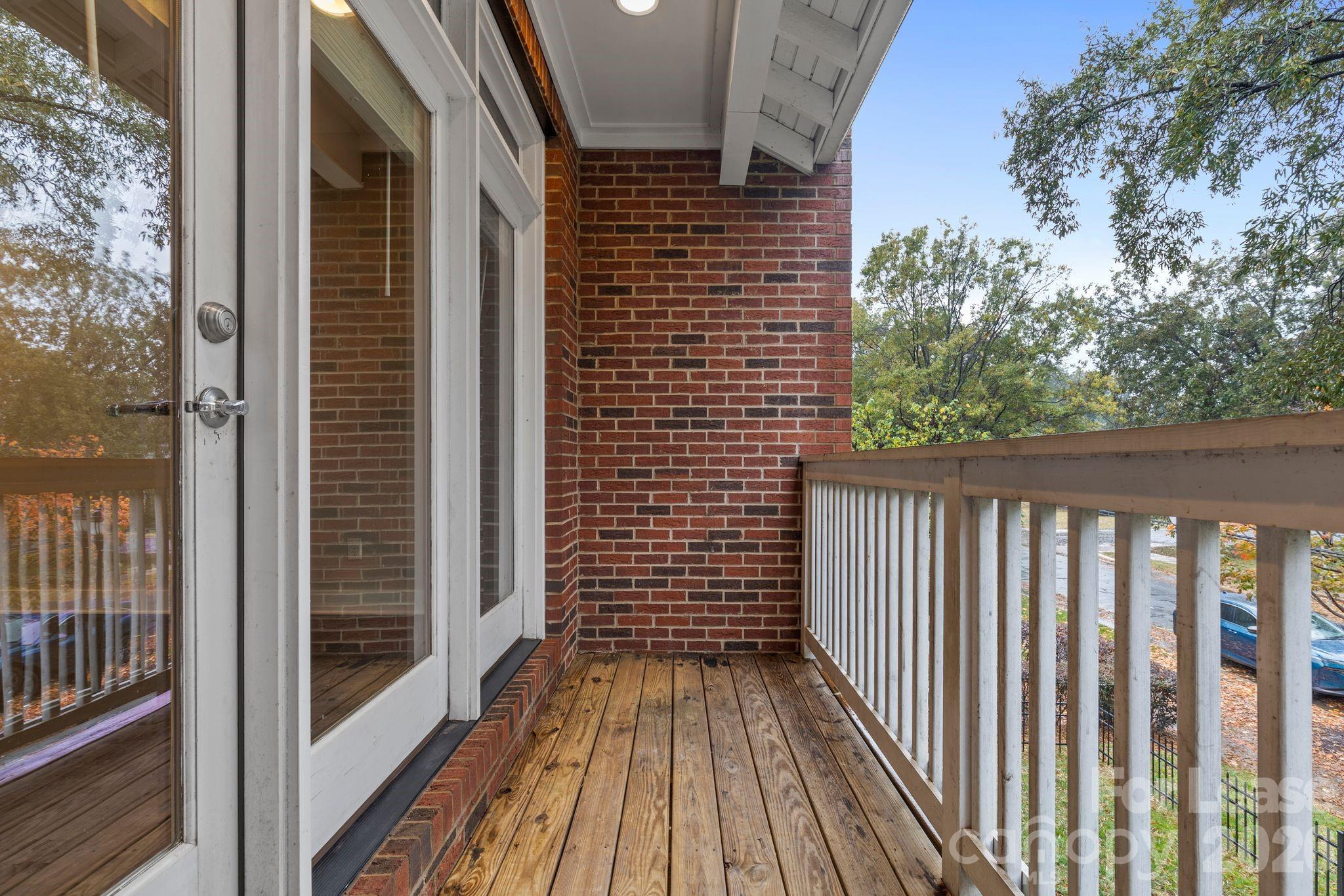 129 Grandin Road Charlotte, NC 28208 - Photo 15 of 26 a view of wooden balcony with a pot