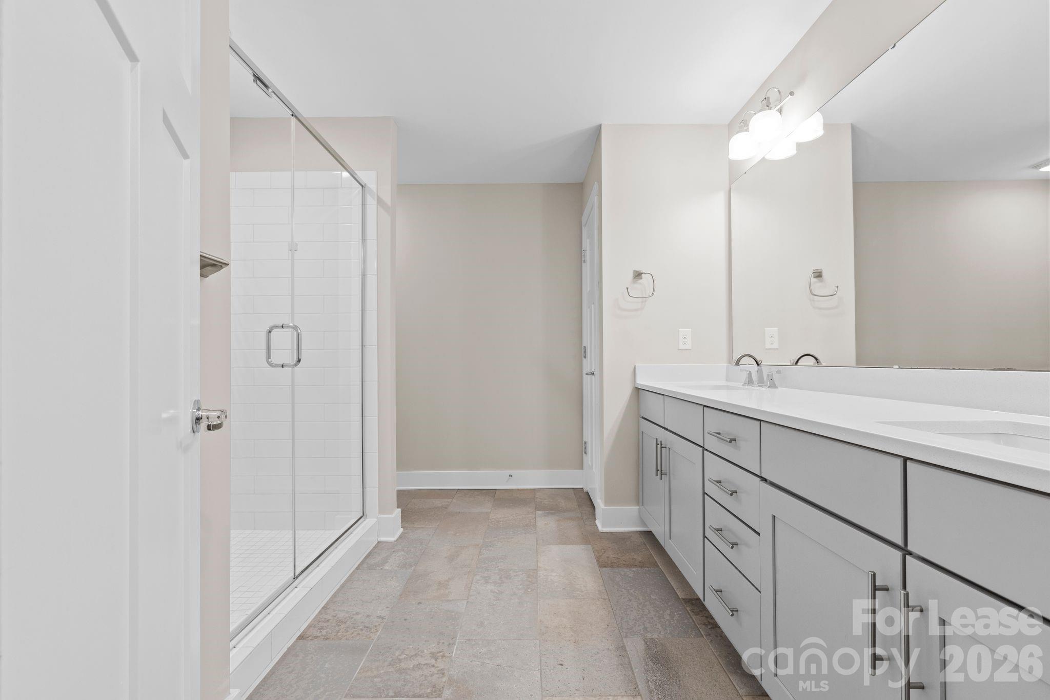 129 Grandin Road Charlotte, NC 28208 - Photo 5 of 26 a bathroom with a double vanity sink and a mirror