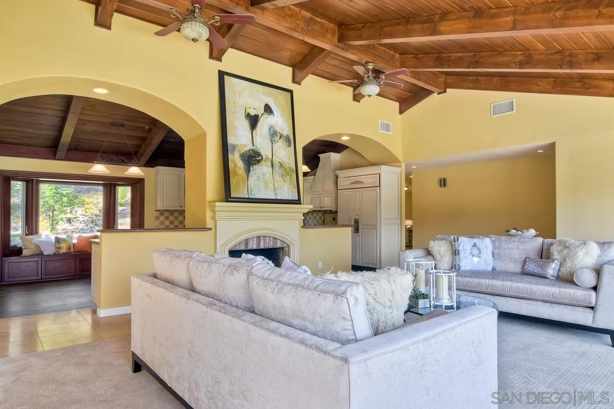 5460 La Crescenta Road Rancho Santa Fe, CA 92067 - Photo 13 of 27 a living room with furniture and a large window