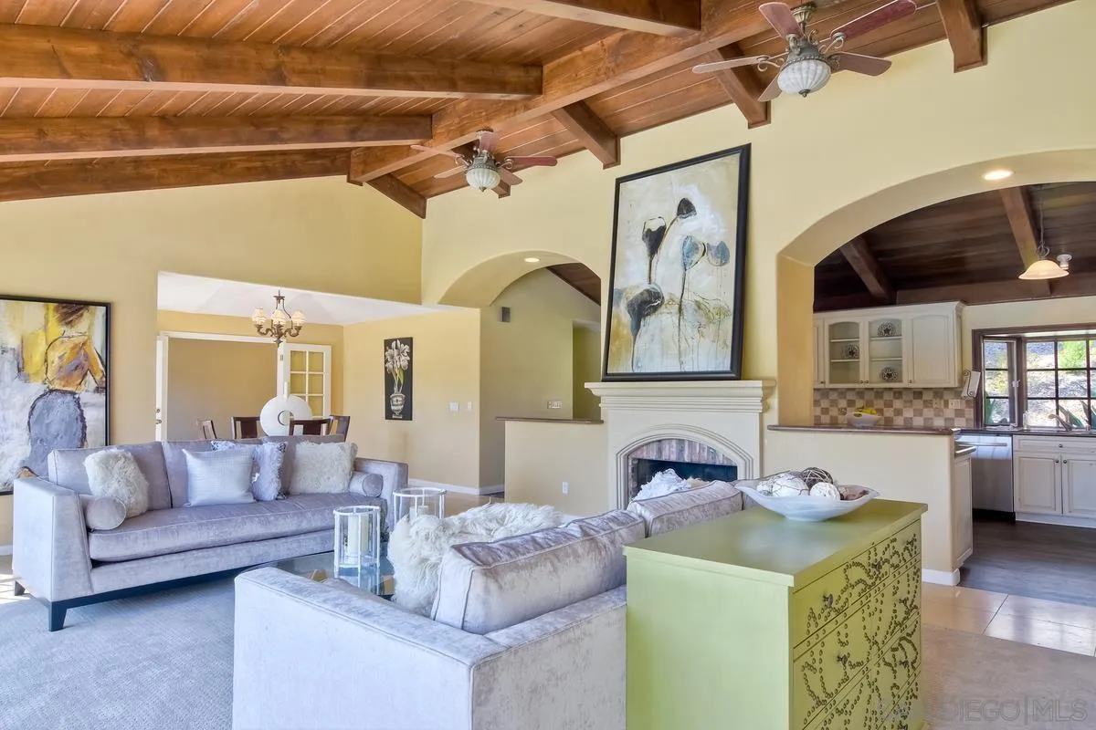5460 La Crescenta Road Rancho Santa Fe, CA 92067 - Photo 14 of 27 a living room with furniture and a fireplace