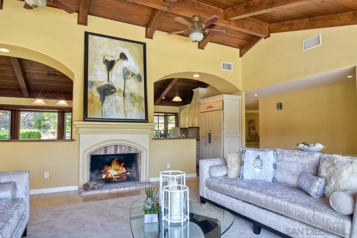 5460 La Crescenta Road Rancho Santa Fe, CA 92067 - Photo 15 of 27 a living room with furniture and a fireplace