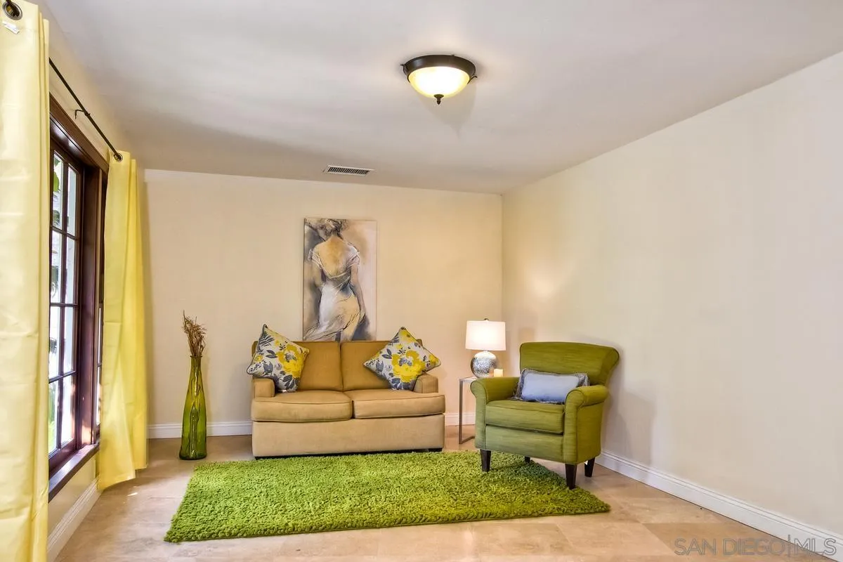 5460 La Crescenta Road Rancho Santa Fe, CA 92067 - Photo 20 of 27 a living room with furniture and a rug