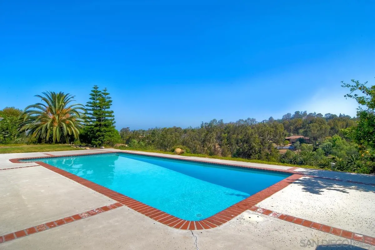5460 La Crescenta Road Rancho Santa Fe, CA 92067 - Photo 23 of 27 a view of swimming pool with a yard