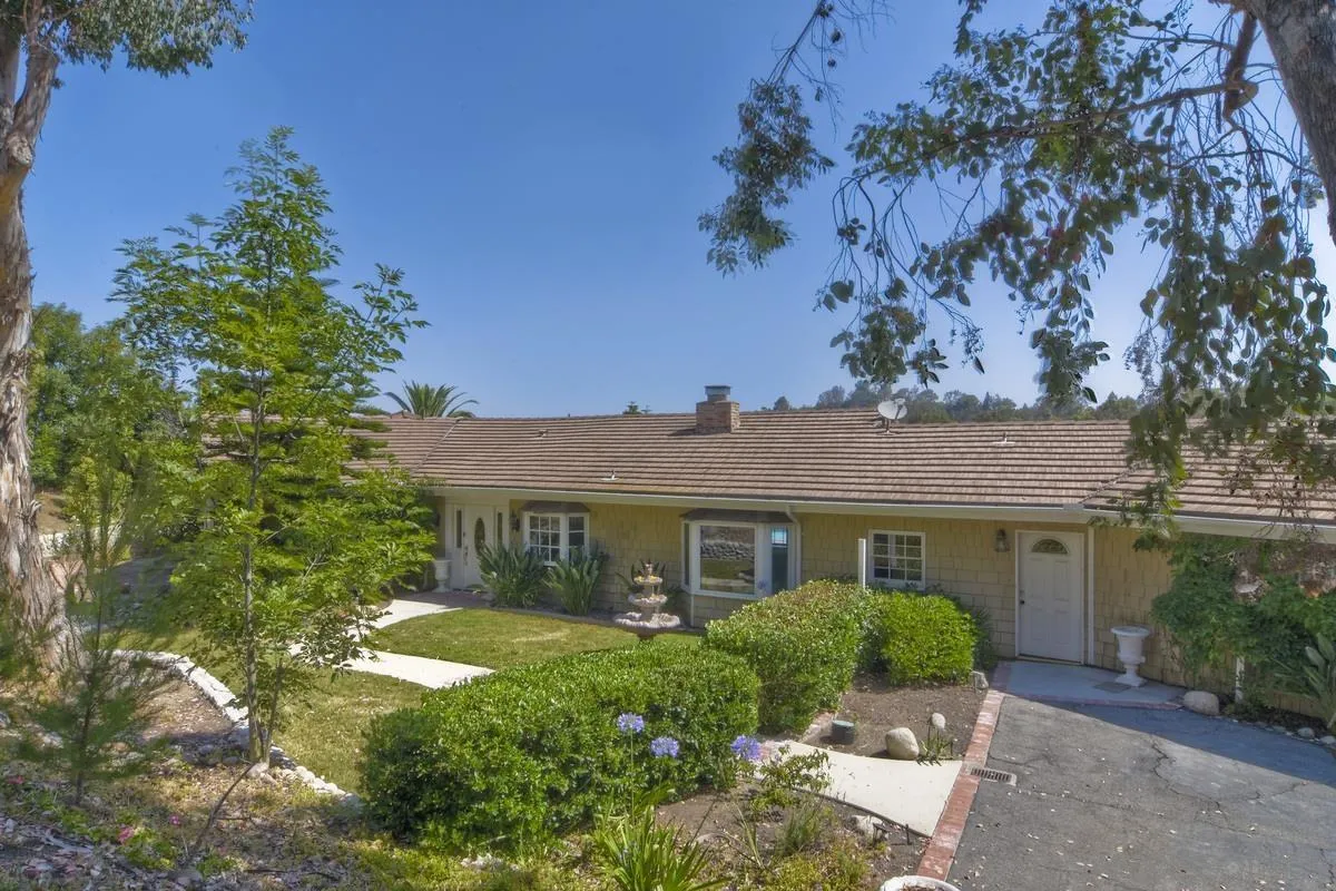 5460 La Crescenta Road Rancho Santa Fe, CA 92067 - Photo 4 of 27 front view of a house with a yard