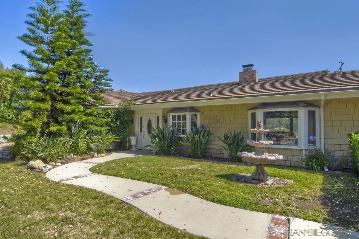5460 La Crescenta Road Rancho Santa Fe, CA 92067 - Photo 5 of 27 a front view of a house with garden