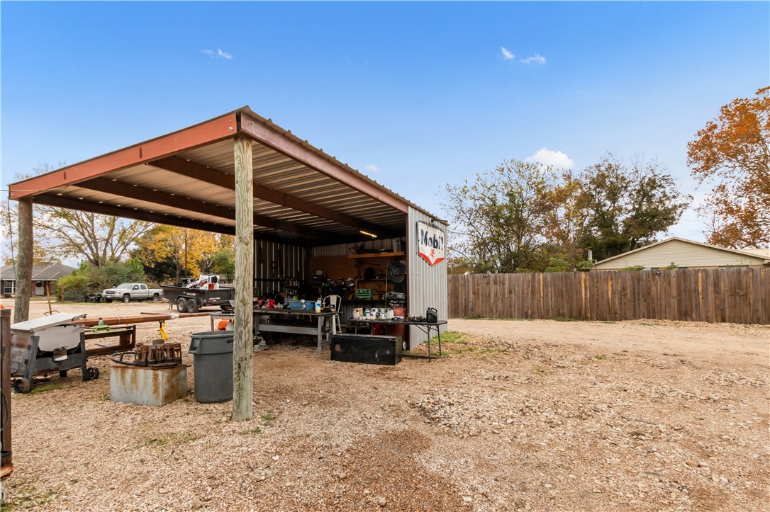 402 Magnolia Gause, TX 77857 - Photo 27 of 27 View of parking / parking lot with a utility shed