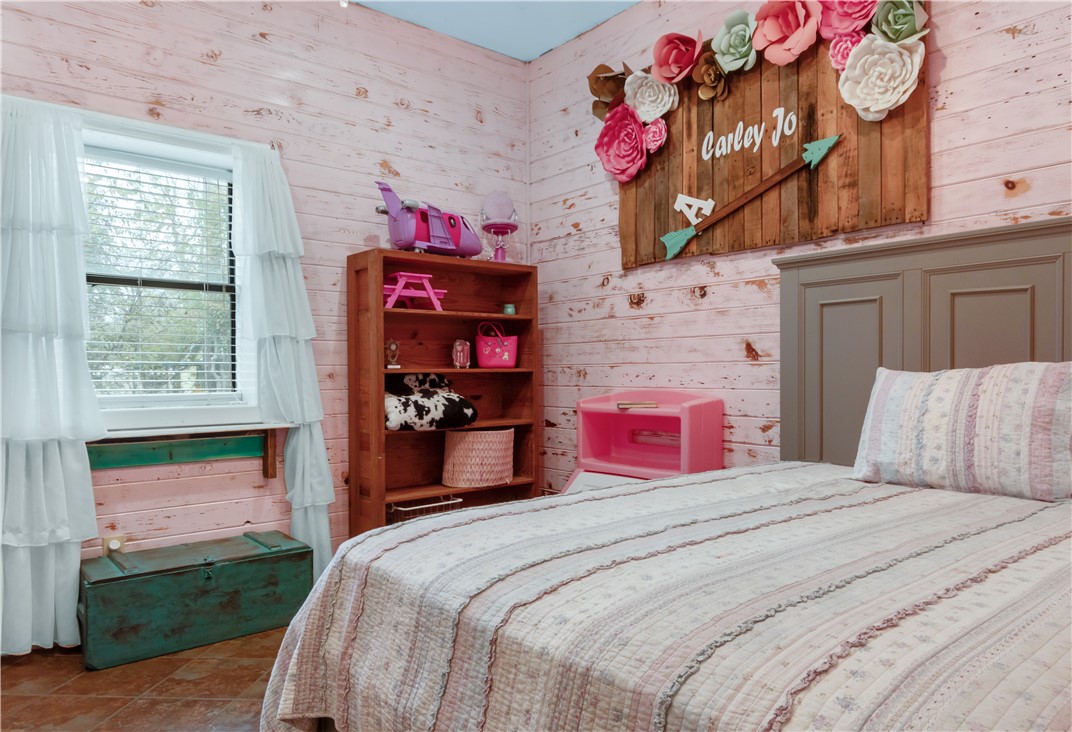 402 Magnolia Gause, TX 77857 - Photo 8 of 27 Bedroom with wooden walls