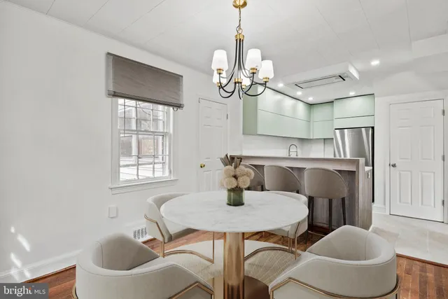 a view of a dining room with furniture and window